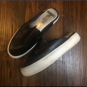 Black slide on shoes.